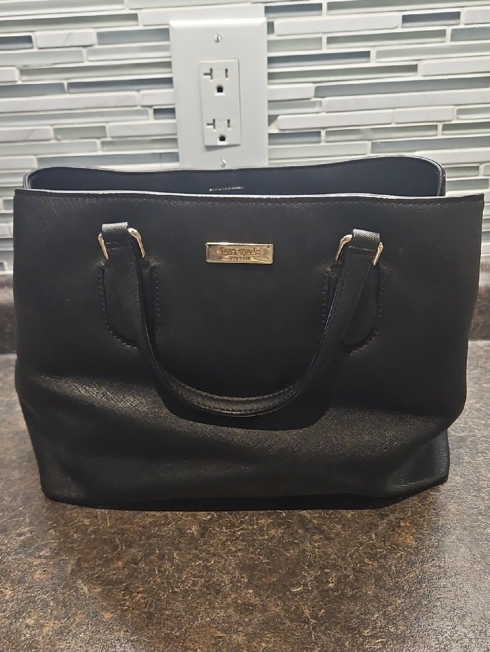 kate spade Black Saffiano Leather Tote with Gold Plaque.  Missing Strap